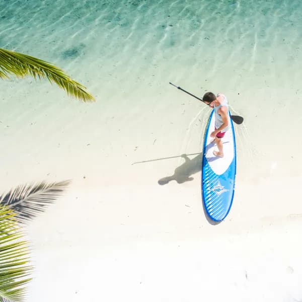 Person paddleboarding, representing work-life balance